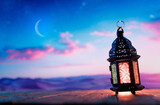 Fototapeta Tulipany - Arabic lantern with burning candle