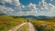 Rural Expedition: As your vehicle moves gently, navigate through a rustic, stone-paved road surrounded by flower fields and green hills, offering a serene countryside panorama.