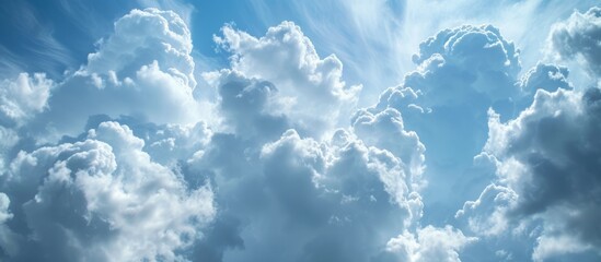 Wall Mural - Beautiful blue sky with fluffy clouds and sun shining through on a sunny day