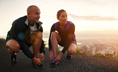 Poster - Fitness, shoes and couple in a road for sunset running, training or morning cardio in nature together. Sneakers, shoelace and sports runner people outdoor for marathon, routine or performance workout