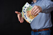 Businessman holding banknotes in his hand. Cash, Euro money.c