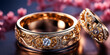 Close up of wedding rings on blurred bokeh background.