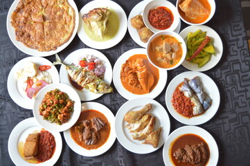 Wall Mural - popular yummy indonesia spicy malay halal food menu curry chicken, rendang beef, asap fish, fried vegetable, begedil potato, chilli sambal achar, egg cuisine for restaurant dining