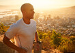 © Katie/peopleimages.com - Fitness, running and man at sunset on cliff for health, wellness and strong body development. Workout, exercise and happy runner on path in nature for marathon training, performance and challenge.