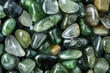 transparent, polished green tone pebble stones background	