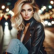 Woman with blonde hair wearing a leather jacket and sitting on a street at night