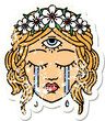 traditional distressed sticker tattoo of female face with third eye crying