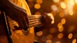 Guitarist playing at sunset. Close-up of guitar strings during golden hour. Musician strumming chords in evening light.