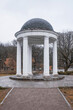 white rotunda with a dome in autumn in a Moscow park