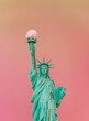 Statue of Liberty holding an ice cream cone instead of the torch. New York, USA summertime background.