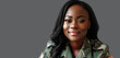 © AB-lifepct - Portrait of beautiful adult black woman military soldier wearing uniform in front of gray background in studio.