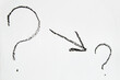 Hand-drawn question mark, boldly marked in black on a white sheet of paper, symbolizing the concept of questioning, uncertainty, and the search for information