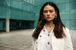 © Jorge Elizaquibel - Mixed race woman looking straight to camera.