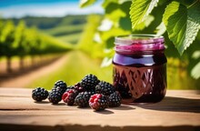 Glass Jar Of Blackberry Jam, Ripe Blackberries, Blackberry Bushes On The Background, Orchard, Sunny Day