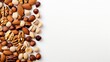 A variety of nuts including pecans, macadamia nuts, walnuts, almonds, and hazelnuts, with space for text, isolated along one edge. (Top view or flat lay)