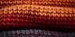 Vibrant knitted wool fabric in earthy autumn tones creates textured background. Concept Autumn Textures, Woolen Backdrops, Vibrant Colors, Knitted Fabrics, Earthy Tones
