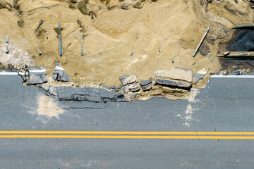 roadworks site. reconstruction of damaged road bridge destroyed by river after flood water washed aw