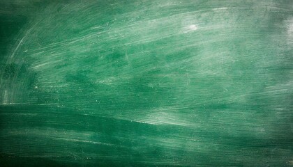 Wall Mural - old green chalkboard texture background closeup of green grunge textured background with scratches and scuffs