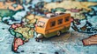 Toy Bus Traveling on World Map