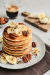 Plate of maple pecan pancakes with fresh bananas