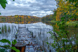 Fototapeta Zachód słońca - Forest landscape and lake in the northern regions of Russia in late autumn.