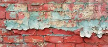 A Close-up View Of A Weathered Red Brick Wall, Showing Signs Of Peeling Paint And Wear.