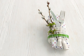 Sticker - Table setting with fork, knife and willow branches for Easter, birthday or mother's day.