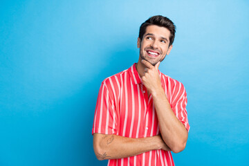 Canvas Print - Photo of dreamy cheerful guy wear red shirt arm chin looking empty space isolated blue color background