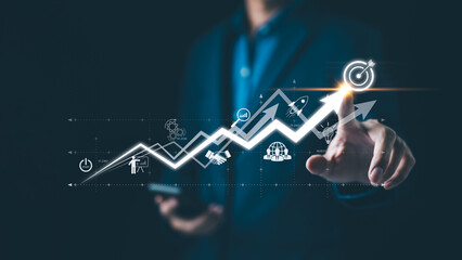 Startup business and investment concept. Businessman is touching the growing business graph. Planning and starting corporate business start up, Rocket icon soars with speed to hit 2024 growth target.