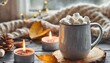 autumn cozy home composition with hot chocolate with marshmallow and candles aromatherapy on a grey fall morning atmosphere of cosiness and relax wooden background window sill close up