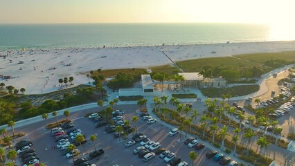 Wall Mural - Parking lot for tourists cars in front of famous Siesta Key beach in Sarasota, USA. Popular vacation spot in warm Florida at sunset