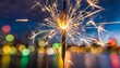 © Deanne - new years eve fireworks sparkler on a colourful blurred background
