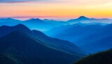 Fototapeta Góry - beautiful layered blue mountains transitioning into the sunset vetical