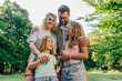 © Zamrznuti tonovi - Portrait of a happy family hugging in nature and smiling at the camera.
