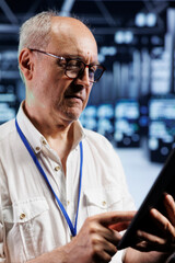 Poster - Qualified electrician in crypto mining farm with specialized electronics using Blockchain technology. Elderly wireman holding clipboard, inspecting asic server rows solving hashing operations