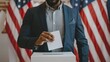 African American man voting in an election. Black voter casting ballot with US flags behind. Male hand placing ballot into voting box. Concept of democracy, presidential elections, freedom, diversity