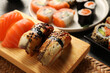 Different tasty sushi rolls on table, closeup