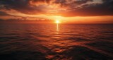 Fototapeta Most -  Sunset's golden glow illuminates the tranquil ocean