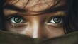 The image is a close-up of a person's face, focusing intensely on the eyes. The eyes are striking, with vibrant green irises surrounded by thick, dark eyelashes. There are reflections in the eyes that