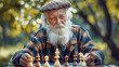 Elderly man concentrating on a chess game.