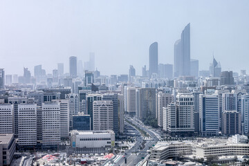 Wall Mural - Aerial view on hazy Abu Dhabi cityscape at afternoon time