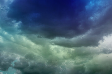 Wall Mural - background of dark clouds before thunder storm
