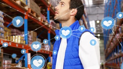 Poster - Animation of network of connections with heart icons over caucasian man working in warehouse
