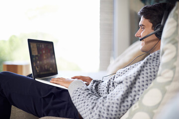 Aufkleber - Man, call center or remote work with laptop for customer service, typing or consulting online. Home, virtual assistant or headset on a happy freelance employee with smile for communication or support