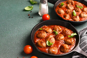 Wall Mural - .Meatballs with tomato sauce and basil in a frying pan