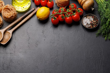 Poster - Cooking scene: Cherry tomatoes, pasta, spices on table