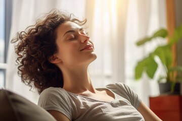 Poster - Woman laying on a couch with her eyes closed. Suitable for lifestyle or relaxation concepts