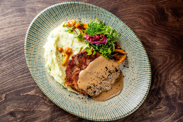 Wall Mural - Grilled beef steak with mashed potato and sauce in plate