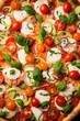 © Fotograf - A delicious pizza topped with tomatoes, cucumbers, and mozzarella cheese. Perfect for food and cooking concepts.