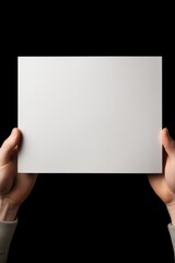 Poster - Person holding a white paper, suitable for business or education concept